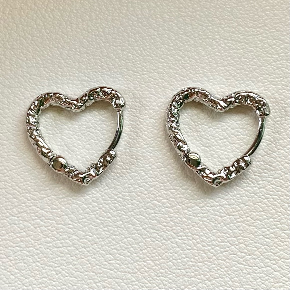 Silver heart shaped hoop earrings